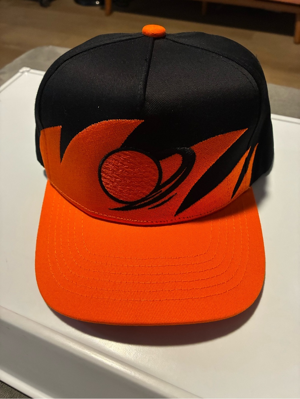 Black and Orange Men's Snapback golf Hat with Planet Graphic